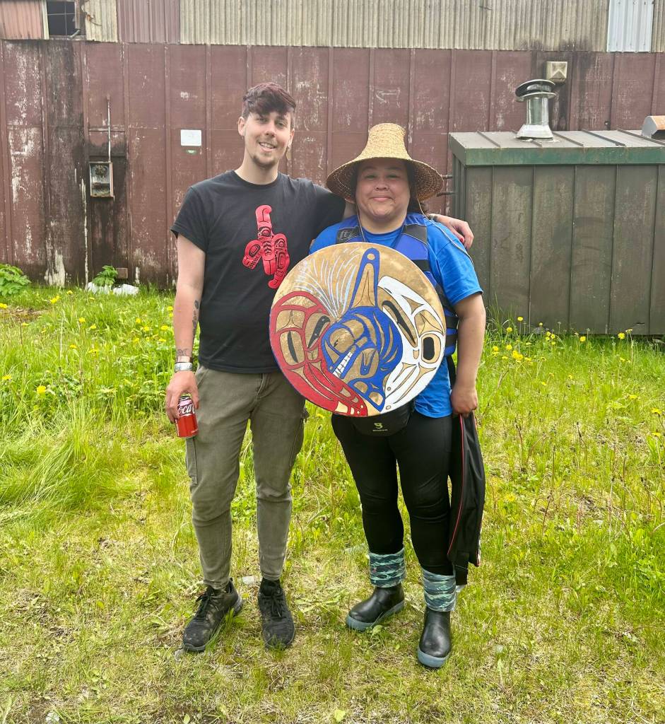 Corey Marsden and Kylee Guthrie pose with Guthries drum for a photo at their campsite in Juneau on Tuesday. (Jasz Garrett / Juneau Empire)