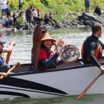 Brooke Leslie waves from Wrangells kéet yaakw (killer-whale canoe) while landing in Juneau on Tuesday. (Jasz Garrett / Juneau Empire)