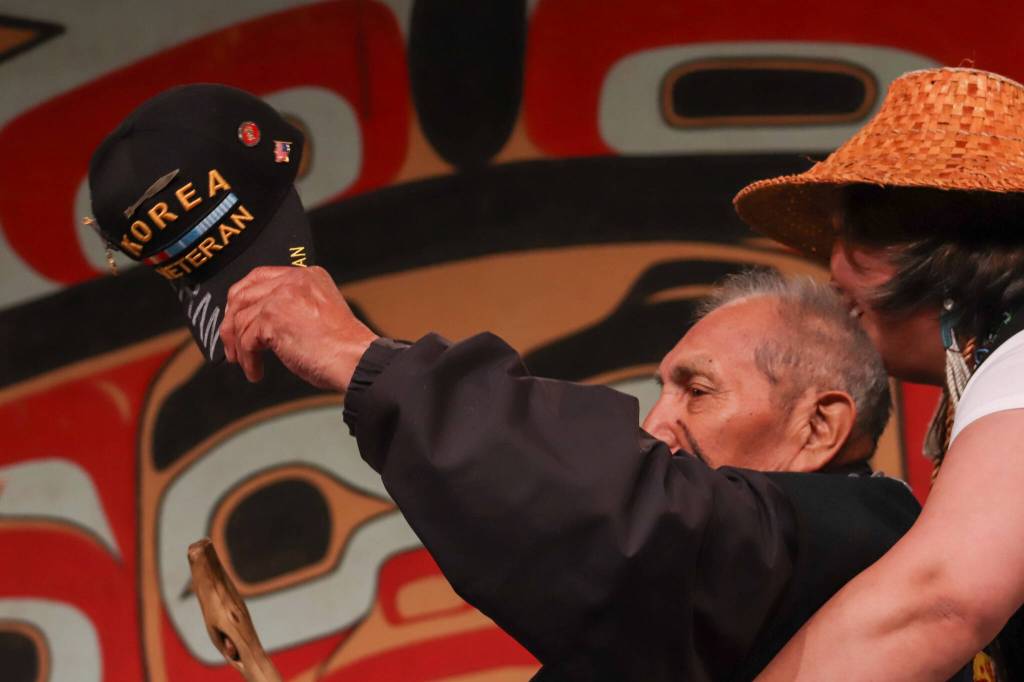 Alaska Native veteran Marvin Kadake arrives on stage in his wheelchair during the Grand Entrance. (Jasz Garrett / Juneau Empire)