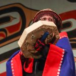 Fran Houston, spokesperson for the Áakw Kwáan, drums at Celebration. (Jasz Garrett / Juneau Empire)