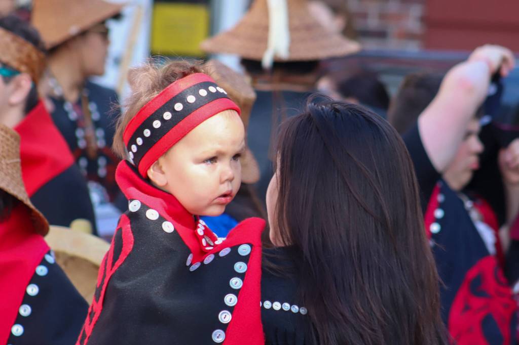 Destiny Starr holds her daughter Evangeline for her first Celebration. (Jasz Garrett / Juneau Empire)