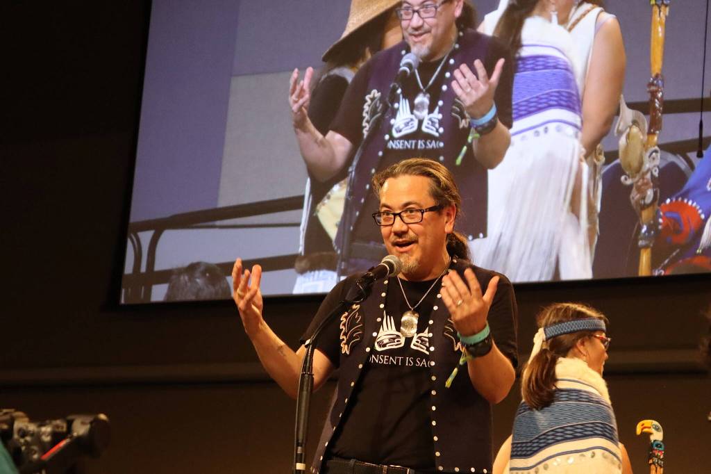 Joe Nelson, board chair of Sealaska Corp., thanks organizers and participants at the end of the Grand Exit ceremony for Celebration at Centennial Hall on Saturday night. (Mark Sabbatini / Juneau Empire)