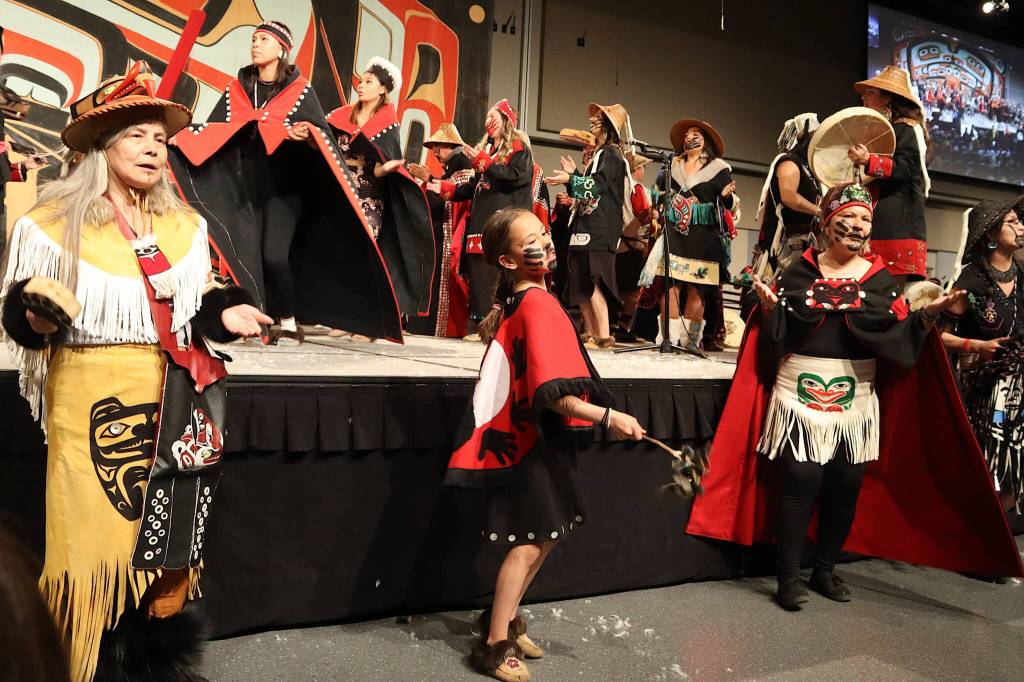 Dancers from multiple generations join side-by-side during the Grand Exit ceremony at Celebration on Saturday night at Centennial Hall. (Mark Sabbatini / Juneau Empire)