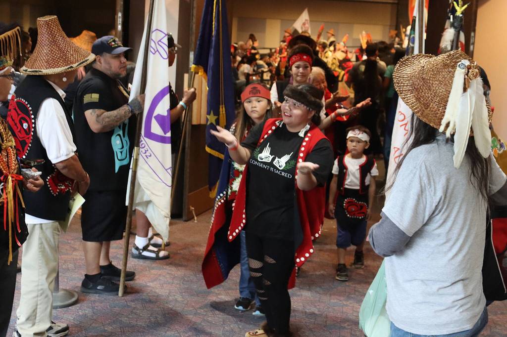 Leandrea Makaily, a Juneau resident, performs a few final dance steps while exiting the main ballroom at Centennial Hall at the end of Celebration on Saturday night. (Mark Sabbatini / Juneau Empire)