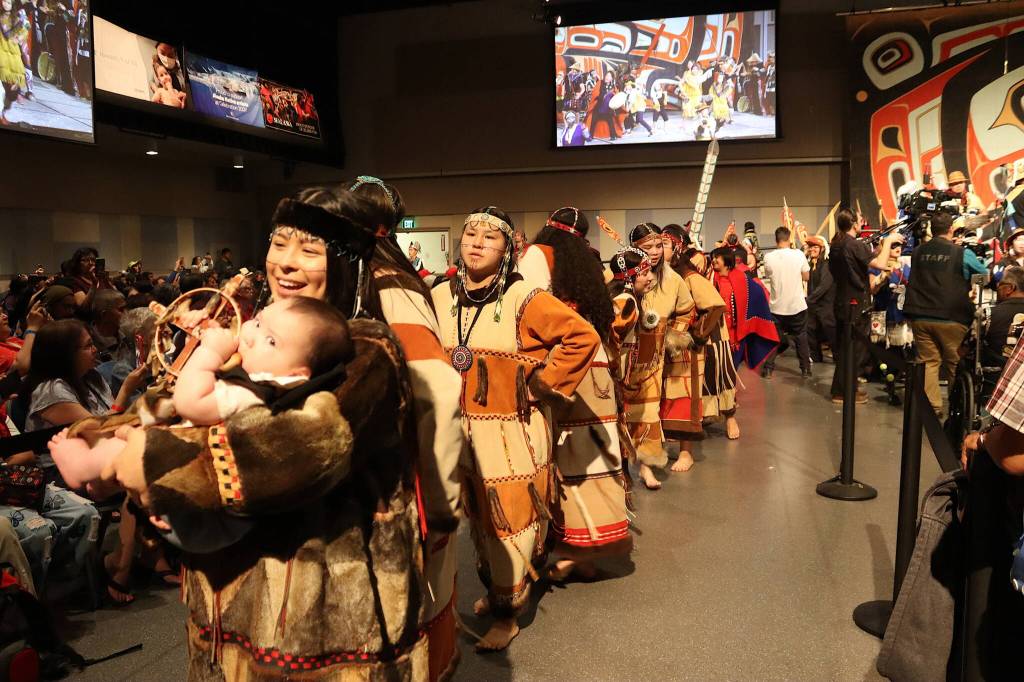 Dancers depart the main ballroom during the Grand Exit ceremony marking the end of Celebration on Saturday night at Centennial Hall. (Mark Sabbatini / Juneau Empire)