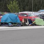 Tents occupied by people experiencing homelessness stand across the street from the Glory Hall on Sunday. (Jasz Garrett / Juneau Empire)