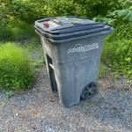 Typical trash service cans are not bear resistant. Keeping trash indoors until pickup day preserves human and bear safety. (Laurie Craig / Juneau Empire)