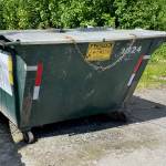 Dumpsters should be anchored to a concrete pad by chains and cable locks on strong metal lids. (Laurie Craig / Juneau Empire)
