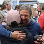 Former Eaglecrest Ski Area Manager Dave Scanlan hugs a supporter during a tribute party to him at an expanded food court on Franklin Street on Friday night. (Mark Sabbatini / Juneau Empire)