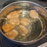 Battered fish fillets frying. (Photo by Patty Schied)