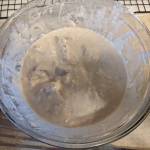 Covering fish with batter in preparation for frying. (Photo by Patty Schied)