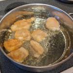 Battered fish fillets frying. (Photo by Patty Schied)