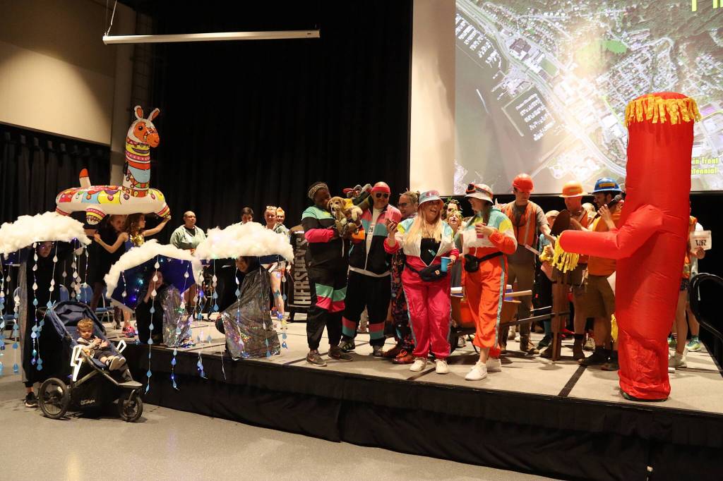 Participants in a costume contest gather on stage at Centennial Hall before the start of the Only Fools Run At Night on Friday. (Mark Sabbatini / Juneau Empire)