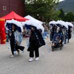 Five adults and a tot calling themselves the Juneau Forecast head out from the starting line of the Only Fools Run At Night to take part in the one-mile course on Friday at Centennial Hall. (Mark Sabbatini / Juneau Empire)