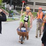 Members of the Trail Mix team reach the finish line of the Only Fools Run At Night on Friday at Centennial Hall. (Mark Sabbatini / Juneau Empire)