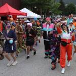 An estimated 185 people, many dressed in unconventional attire for running or walking, take off from the starting line outside Centennial Hall during the Only Fools Run At Night on Friday. (Mark Sabbatini / Juneau Empire)
