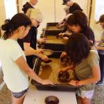 People try their luck at panning for gold during Juneau Gold Rush Days on Saturday at Savikko Park. (Mark Sabbatini / Juneau Empire)