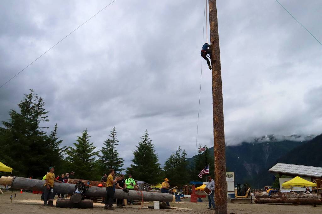 A woman nears the designated point during the speed climbing competition at Juneau Gold Rush Days on Sunday at Savikko Park. (Mark Sabbatini / Juneau Empire)