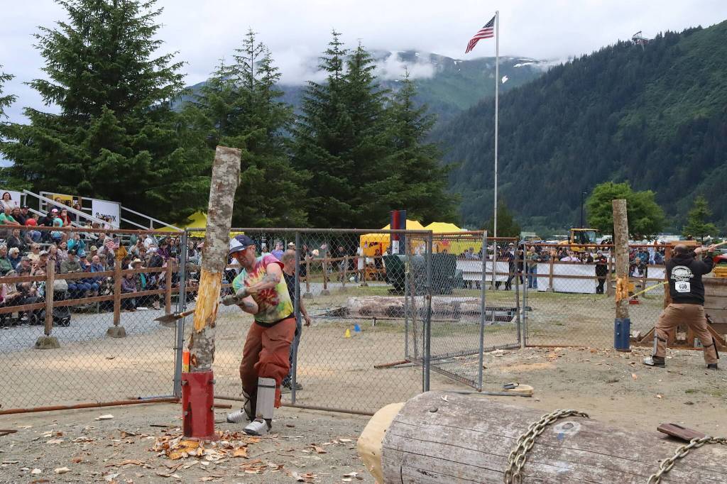 Jesse Stringer, foreground, and Jeff Trego compete in the mens vertical chopping competition during Juneau Gold Rush Days at Savikko Park on Sunday. (Mark Sabbatini / Juneau Empire)