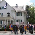 Participants in a pro-choice abortion rally gather outside the Governors Residence on Saturday to demand a pro-life flag flying at the entrance be taken down. (Mark Sabbatini / Juneau Empire)