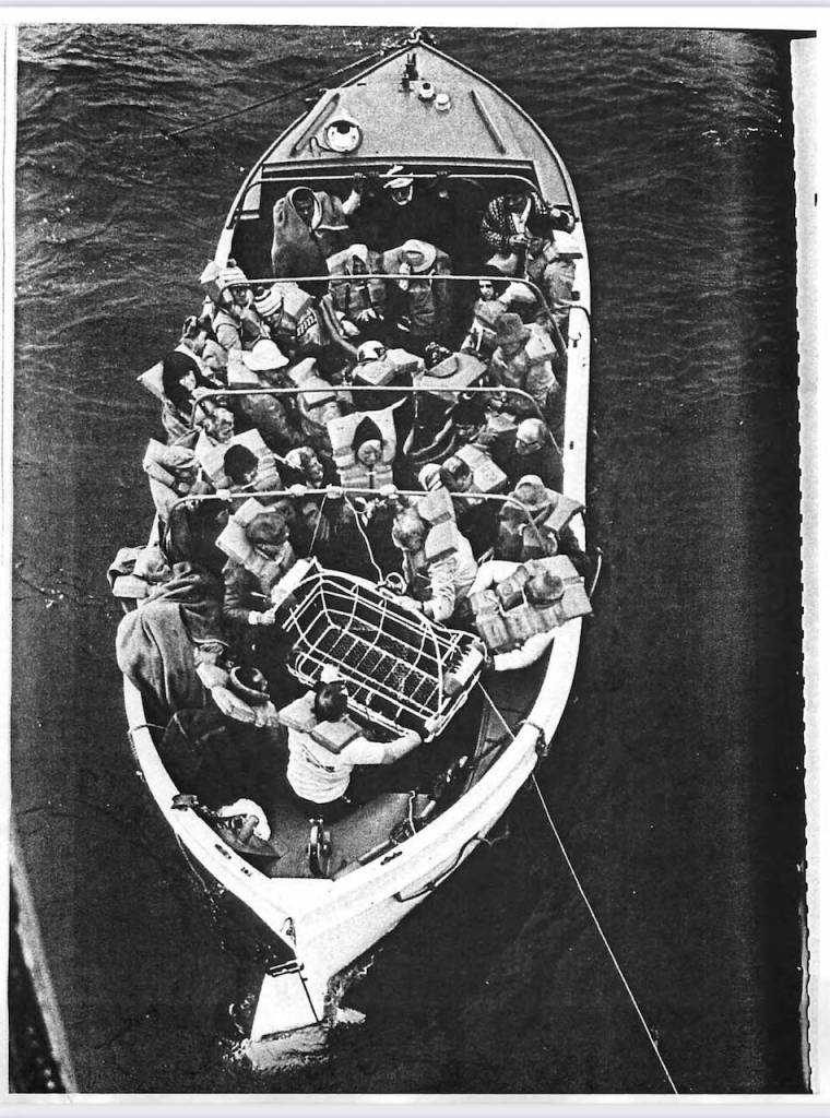 Prinsendam evacuees await hoisting from their lifeboat on Oct. 5, 1980. (Dave Cook / U.S. Coast Guard)