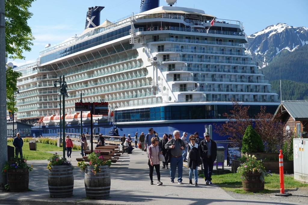 A cruise ship with several orange lifeboats visible is docked in downtown Juneau on June 20. With 10 times as many people aboard present-day cruise ships as were on the Prinsendam in 1980, the U.S. Coast Guard says it is well prepared to safely evacuate passengers due to advanced communications, navigation and continuous scenario training. Officials say another cruise ship offers the best rescue potential for assisting in response. (Laurie Craig / Juneau Empire)