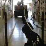 Workers at a Homer boatyard load a net for shipment last month. The downturn in Alaskas fishing industry has hit not just fishermen and processing companies but also other maritime businesses. In Homer, supply company Nomar Alaska got two orders of specially designed fish bags during a November fishermens convention  down from 25 to 30 orders in a normal year. Were feeling it, said Jennifer Hakala, Nomars office manager. (Nathaniel Herz/Northern Journal)