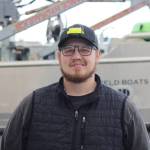 Toph Clucas takes a break from preparing his fishing vessel in a boatyard in Homer in May to pose for a photo. Clucas, 26, fishes off Kodiak Island, and hes taken on more than $200,000 in debt to finance his boat and other assets needed to get into the industry. Im pretty much just buckling in and trying to make it til the market comes back up, he said. Its my livelihood and its what I love doing. (Nathaniel Herz/Northern Journal)