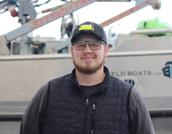 Toph Clucas takes a break from preparing his fishing vessel in a boatyard in Homer in May to pose for a photo. Clucas, 26, fishes off Kodiak Island, and hes taken on more than $200,000 in debt to finance his boat and other assets needed to get into the industry. Im pretty much just buckling in and trying to make it til the market comes back up, he said. Its my livelihood and its what I love doing. (Nathaniel Herz/Northern Journal)