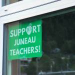 A Support Juneau Teachers sign remains in the window of the now-empty Marie Drake Building. (Jasz Garrett / Juneau Empire)