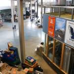Juneau School District maintenance and custodial crew work on transitioning Thunder Mountain High School to Thunder Mountain Middle School on Monday. (Jasz Garrett / Juneau Empire)