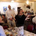 Meilani Schijvens (center), owner of Rain Coast Data, talks with attendees at a Juneau Chamber of Commerce luncheon on Thursday before presenting results from an annual economic survey by her company. (Mark Sabbatini / Juneau Empire)