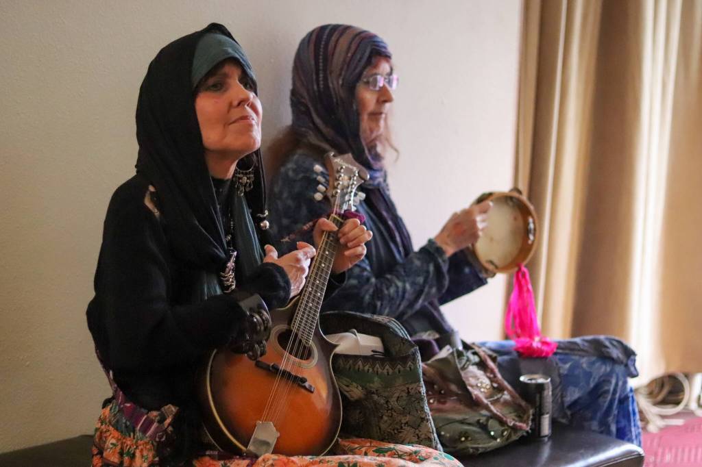 Elle Z Rox and Kym Stover play music together at the third annual Masters Faire on Saturday. (Jasz Garrett / Juneau Empire)