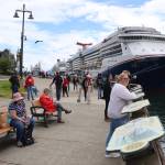 Cruise ships and passengers visit Marine Park on Saturday, June 22. A petition approved for the fall ballot would ban large cruise ships on Saturday and the Fourth of July in Juneau. (Mark Sabbatini / Juneau Empire file photo)