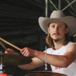 Jacob Patrick, drummer for Copenhagen Cowboys, performs at the second annual Burning Pines concert in Gustavus on Saturday. (Jasz Garrett / Juneau Empire)