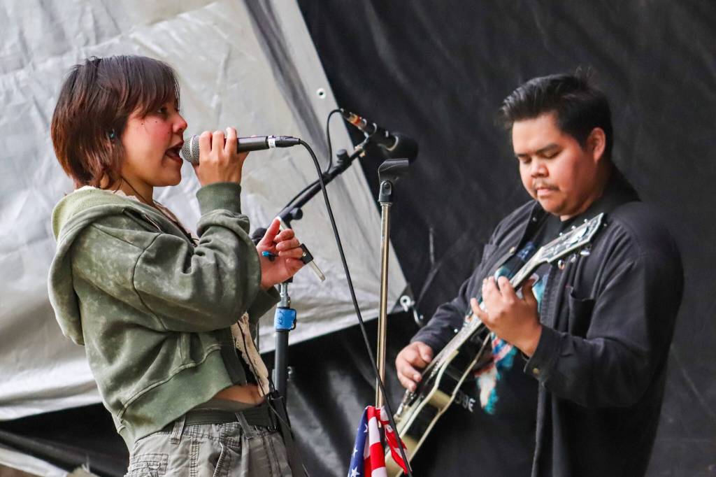 Garden of Agony lead vocalist Daizy Floyd and guitarist David Friday rock out at Burning Pines on Saturday in Gustavus. (Jasz Garrett / Juneau Empire)
