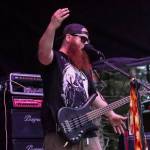 Alex Kotlarsz, lead singer and bassist for Bards of Mendenhell, performs at Burning Pines in Gustavus on Saturday. (Jasz Garrett / Juneau Empire)