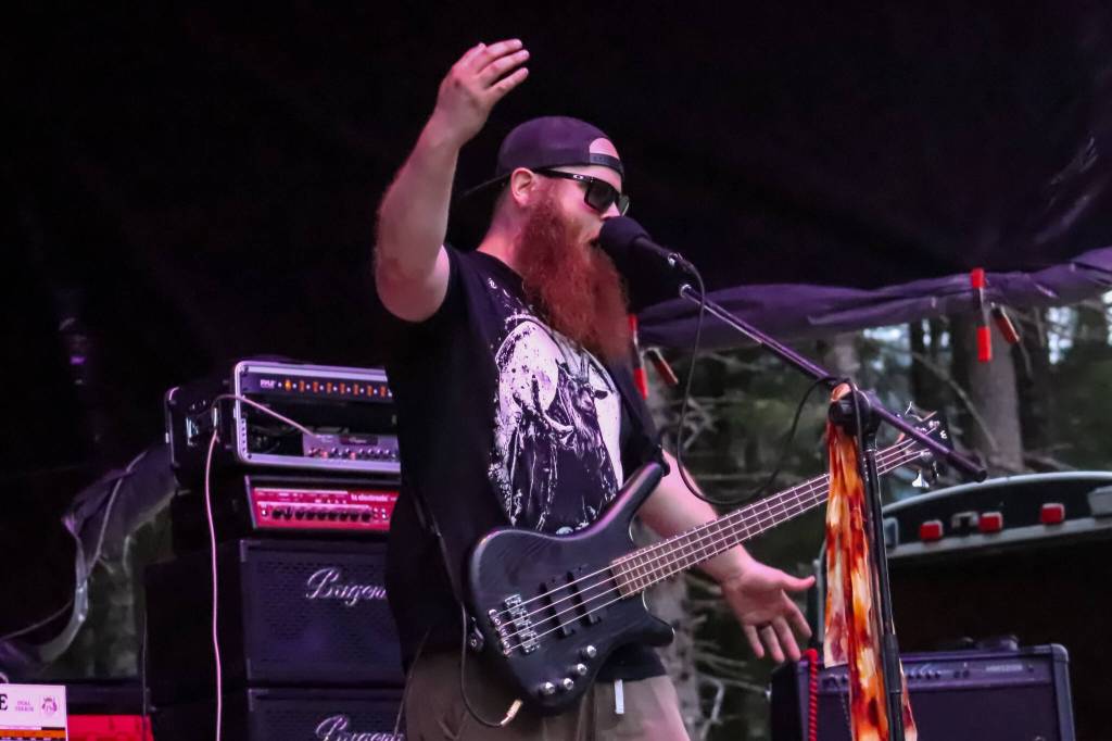 Alex Kotlarsz, lead singer and bassist for Bards of Mendenhell, performs at Burning Pines in Gustavus on Saturday. (Jasz Garrett / Juneau Empire)