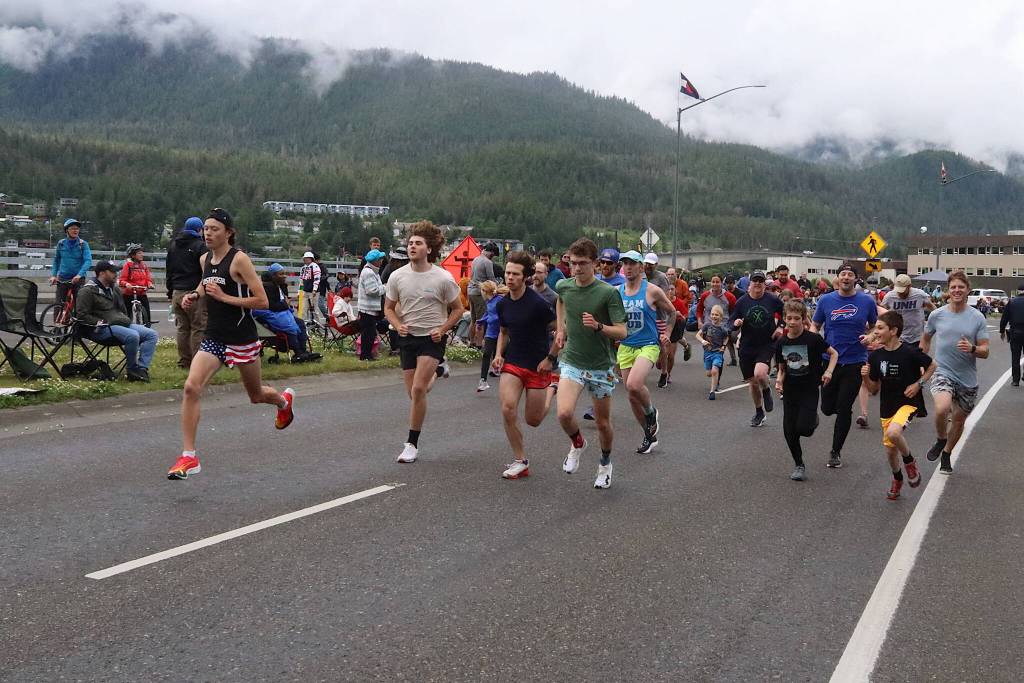 Participants take off from the starting line in the 11th Annual Glenn Frick Memorial Run in downtown Juneau about 30 minutes before the annual Fourth of July parade starts. (Mark Sabbatini / Juneau Empire)