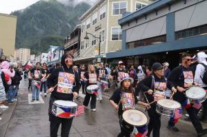 Drummers with the Ati-Atihan Juneau Group make their way along Franklin Street during Juneaus annual Fourth of July parade on Thursday morning. (Mark Sabbatini / Juneau Empire)