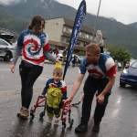 Cade Jobsis, 3, walks with assistance from his parents in Juneaus Fourth of July Parade on Thursday morning. He suffers from a rare genetic disease known as AP-4-associated hereditary spastic paraplegia, and the familys participation in the parade was part of an awareness and fundraising effort. (Mark Sabbatini / Juneau Empire)
