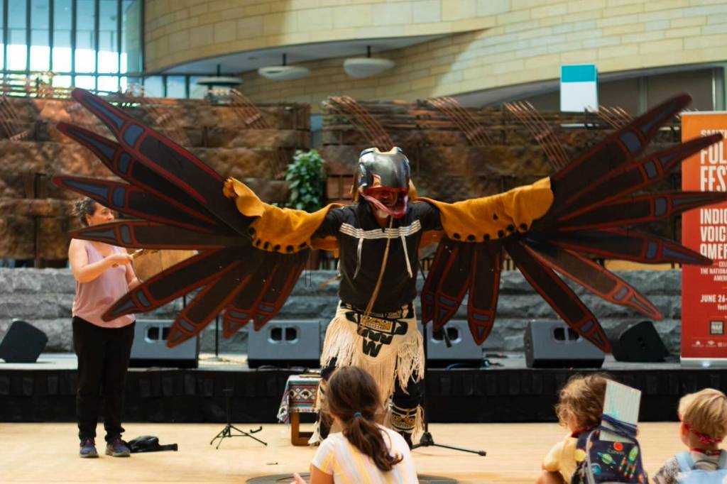 Gene Tagaban, a Juneau resident, ends his story and joins with the Raven spirit for one final dance during the Smithsonian Folklife Festival in Washington, D.C., between June 26 and July 1. (Photo by Maria James)