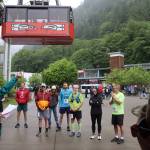 Linda Kruger, director of the Goldbelt Tram-Mount Roberts Trail Run, gives instructions to participants at the base of the tram just before the start of the race Saturday. (Mark Sabbatini / Juneau Empire)