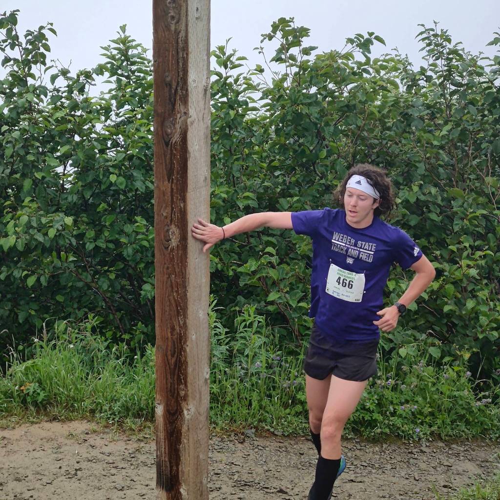 Connor Arnell reaches Father Browns Cross to win the Goldbelt Tram-Mount Roberts Trail Run with a time of 34 minutes and 28 seconds on Saturday. (Photo by Myron Davis)