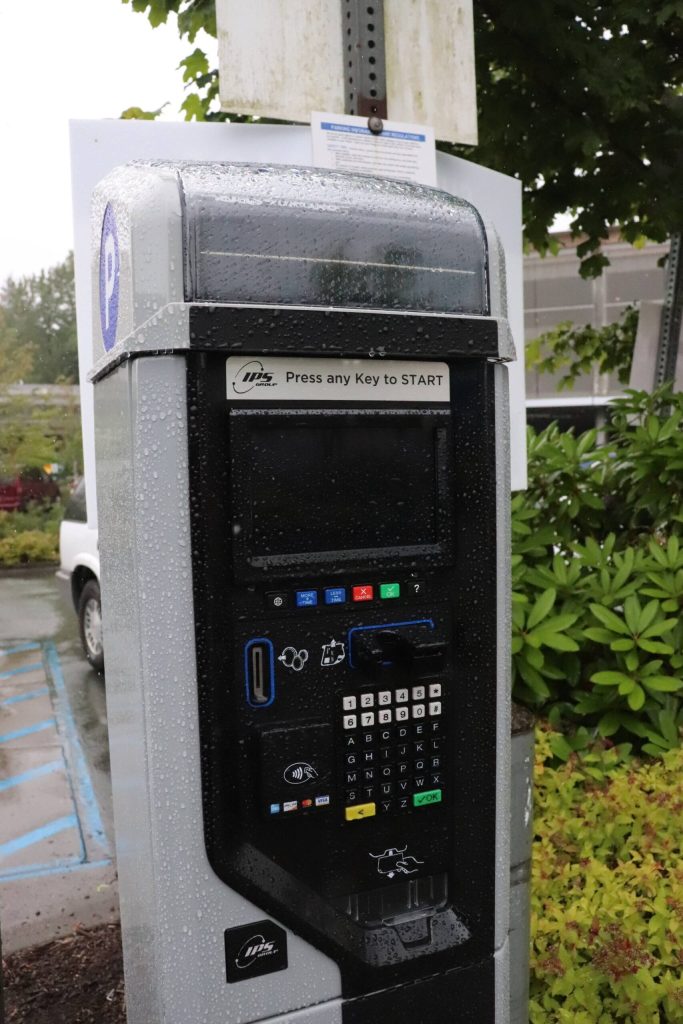 A newly installed pay to park system is seen by the Downtown Transit Center. (Jasz Garrett / Juneau Empire)