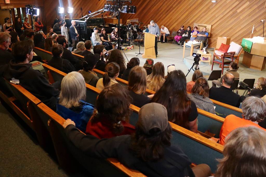 A standing-room crowd fills Resurrection Lutheran Church on Tuesday evening during a vigil for Steven Kissack, a longtime Juneau resident experiencing homelessness who was fatally shot by police on Monday. (Mark Sabbatini / Juneau Empire)