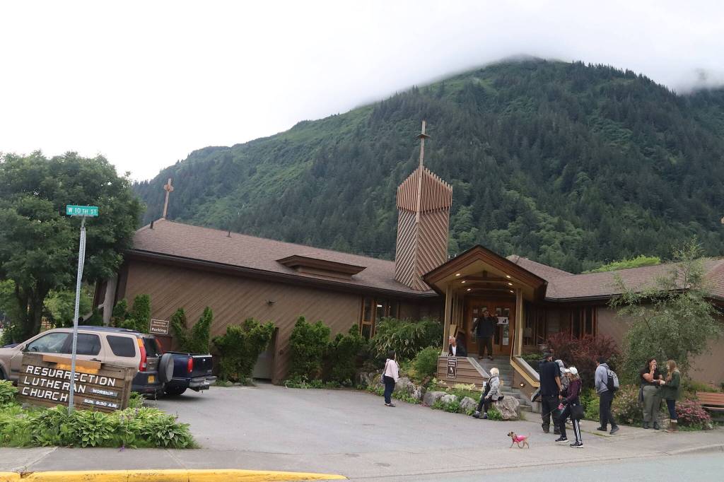 People gather outside Resurrection Lutheran Church on Tuesday evening before a vigil for Steven Kissack, a longtime Juneau resident experiencing homelessness who was fatally shot by police on Monday. (Mark Sabbatini / Juneau Empire)