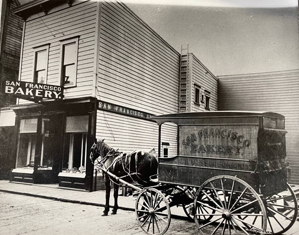 Gus Messerschmidts 1900s San Francisco Bakery on Second Street in Juneau with its horse-drawn delivery wagon on the wood-planked street. (Winter and Pond Photo, ASL-P117-299)