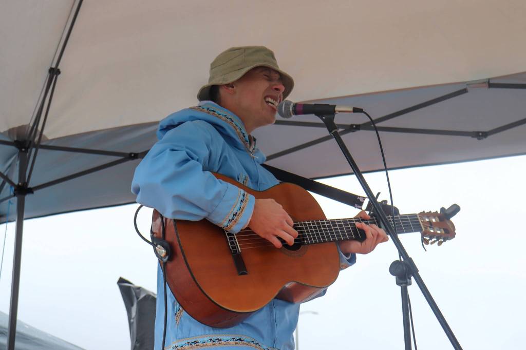 Quinn Christopherson, an Alaskan Native musician from Anchorage who played at last years Áakw Rock Indigenous music festival, performs at the Climate Fair for a Cool Planet on Saturday. (Jasz Garrett / Juneau Empire)