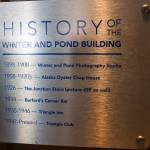 A plaque inside the Triangle Club shows the history of ownership. (Jasz Garrett / Juneau Empire)